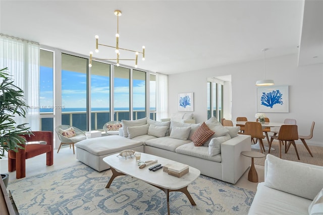 living room featuring a water view, a wall of windows, and a chandelier