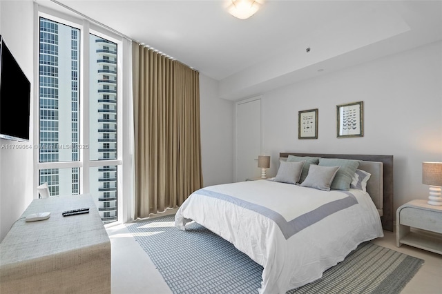 bedroom featuring floor to ceiling windows