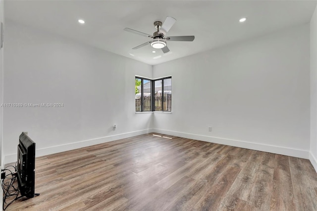 unfurnished room featuring ceiling fan and light hardwood / wood-style floors