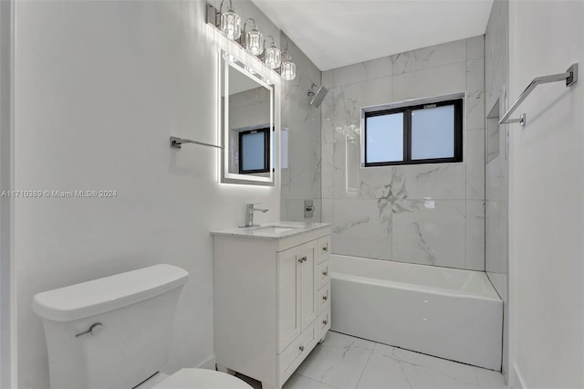 full bathroom with toilet, vanity, and tiled shower / bath