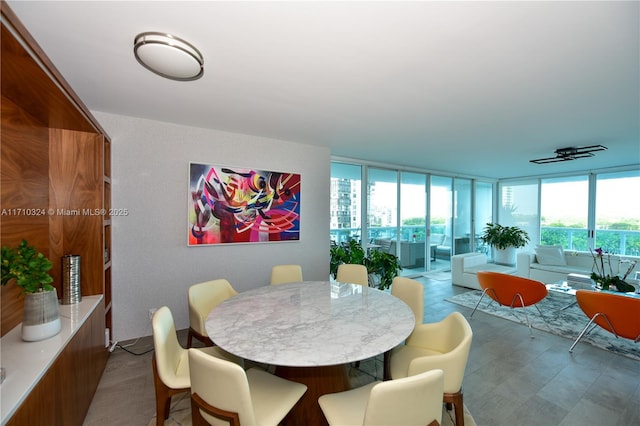 2127 Brickell Ave Unit 1005, Miami, FL 33129 - dining area featuring a wall of windows