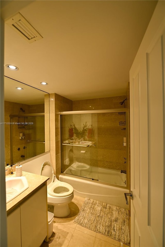 2127 Brickell Ave Unit 1005, Miami, FL 33129 - full bath with tile patterned floors, vanity, toilet, recessed lighting, and shower / bath combination with glass door