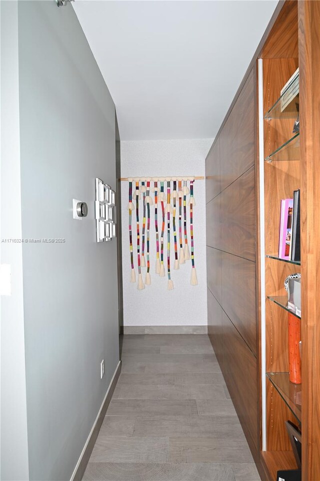 2127 Brickell Ave Unit 1005, Miami, FL 33129 - hallway with wood finished floors and baseboards