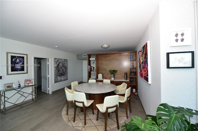 dining space featuring light wood-type flooring