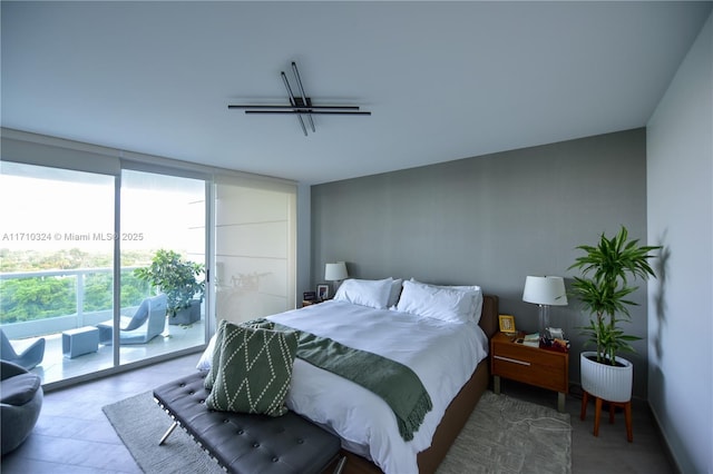 2127 Brickell Ave Unit 1005, Miami, FL 33129 - bedroom with expansive windows and access to outside