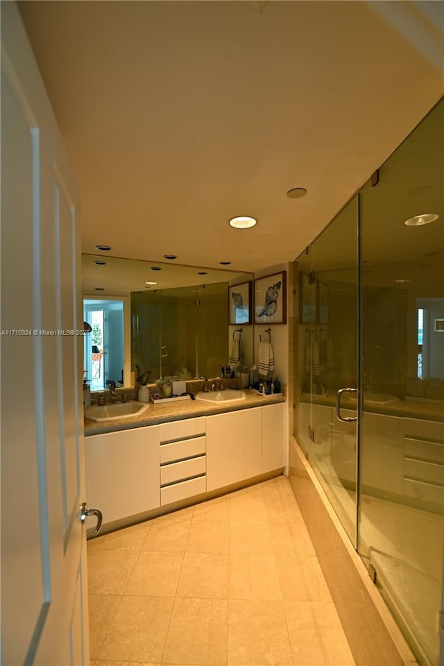 2127 Brickell Ave Unit 1005, Miami, FL 33129 - full bathroom with a shower stall, double vanity, and recessed lighting
