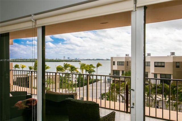 balcony featuring a water view