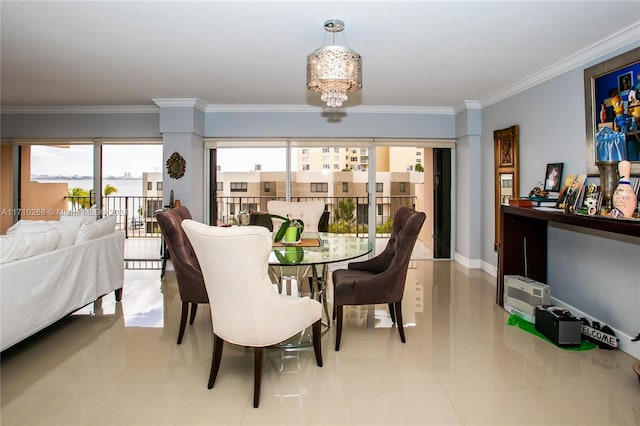 tiled dining room featuring a notable chandelier and ornamental molding