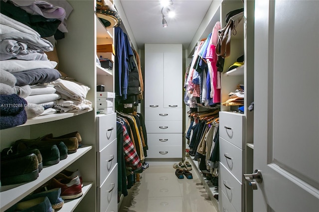 walk in closet featuring tile patterned flooring