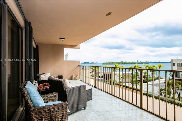 balcony featuring a water view