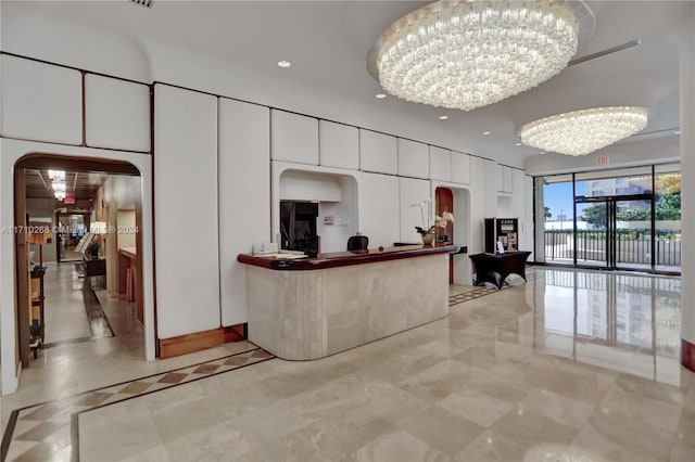 reception area featuring an inviting chandelier