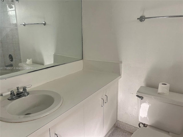 bathroom with vanity and toilet