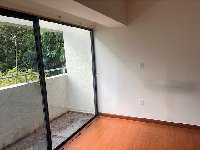 doorway to outside with hardwood / wood-style floors