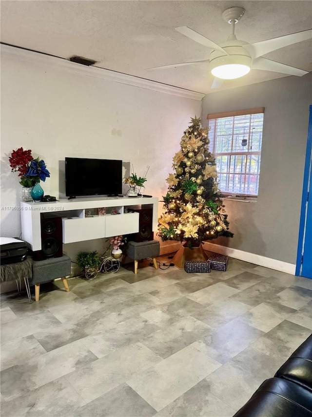 interior space featuring ceiling fan and ornamental molding