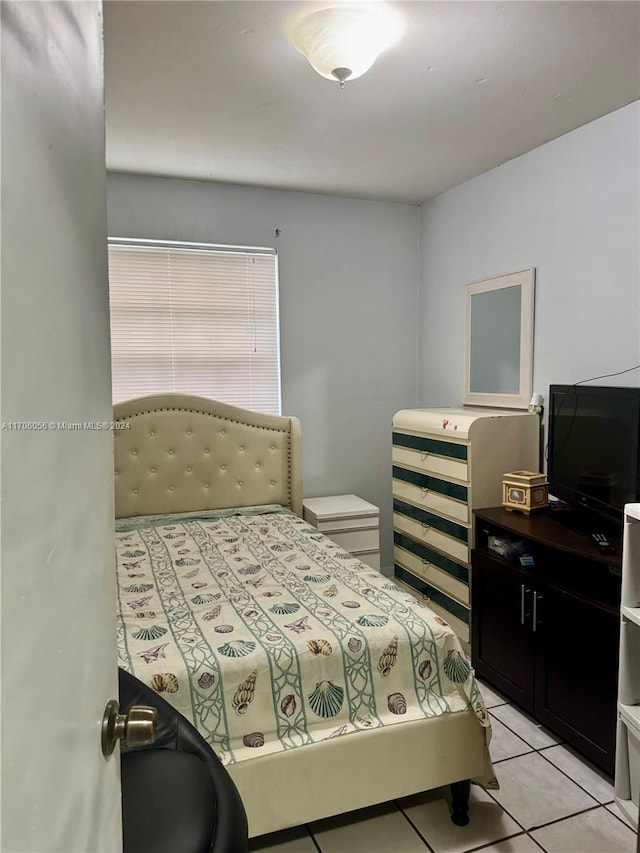 bedroom featuring light tile patterned flooring