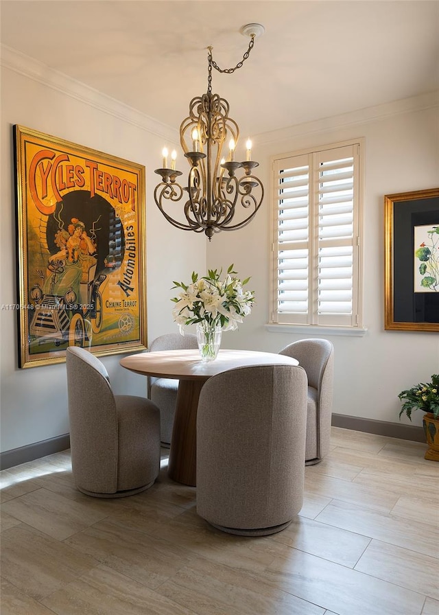 dining space featuring wood-type flooring, a chandelier, and crown molding