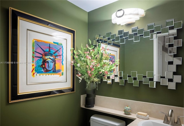 bathroom with sink and toilet