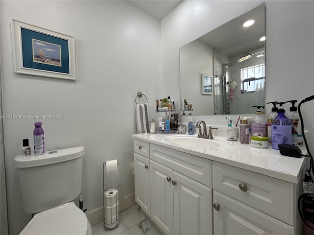 bathroom with vanity, toilet, and an enclosed shower