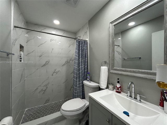 bathroom with toilet, vanity, and a shower with shower curtain