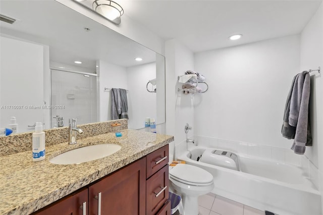 bathroom with tile patterned flooring, vanity, toilet, and an enclosed shower