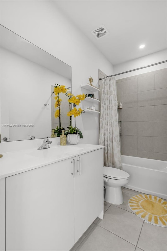 full bathroom with tile patterned floors, vanity, toilet, and shower / bath combo