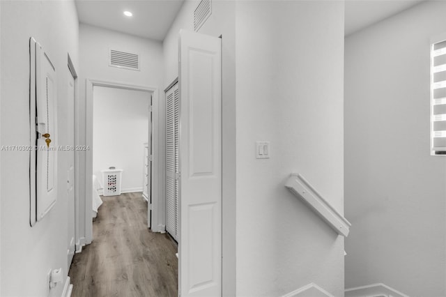 corridor with light wood-type flooring