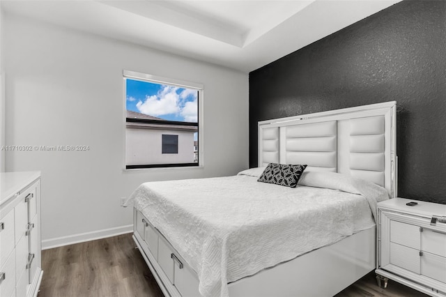 bedroom featuring dark hardwood / wood-style flooring