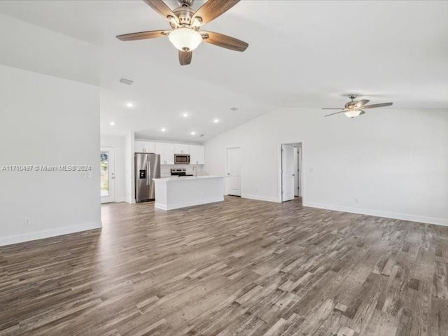 unfurnished living room with hardwood / wood-style floors, ceiling fan, and lofted ceiling