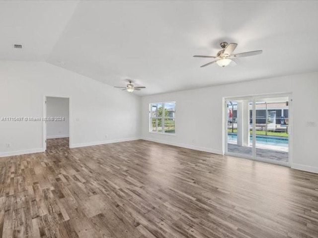 unfurnished living room with hardwood / wood-style flooring, ceiling fan, and lofted ceiling