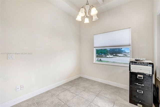 interior space with light tile patterned flooring and a notable chandelier