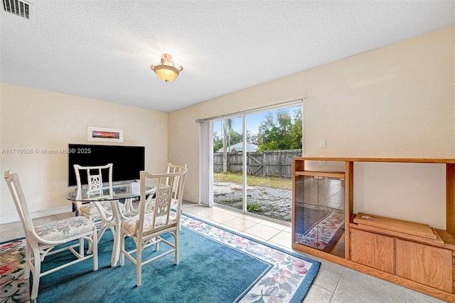 dining room with tile patterned flooring