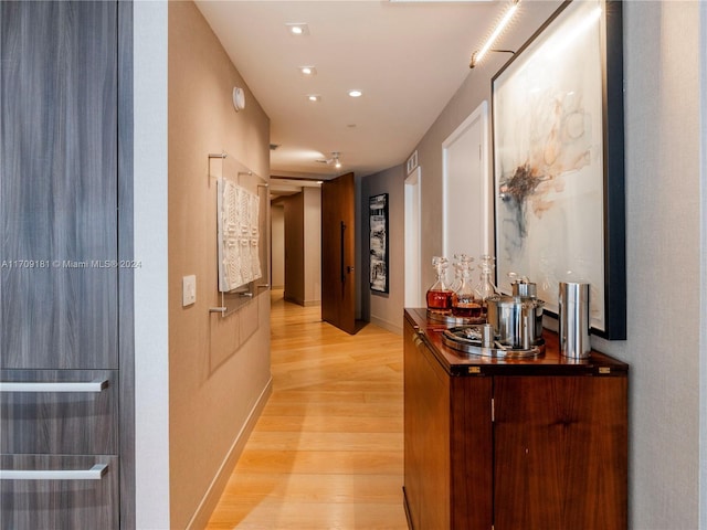 corridor featuring light hardwood / wood-style floors