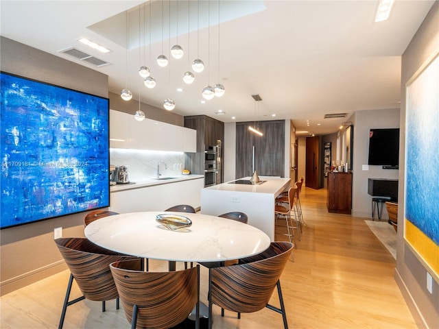 851 NE 1st Ave Unit 1212, Miami, FL 33132 - dining room with light wood-style flooring