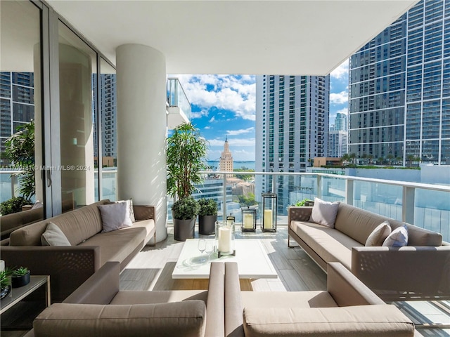 851 NE 1st Ave Unit 1212, Miami, FL 33132 - balcony featuring an outdoor living space and a city view