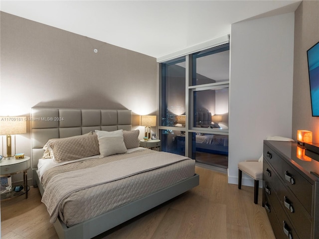 bedroom featuring light wood-type flooring