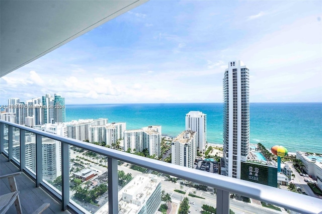 balcony featuring a water view