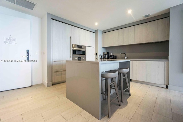 kitchen featuring a breakfast bar and a kitchen island