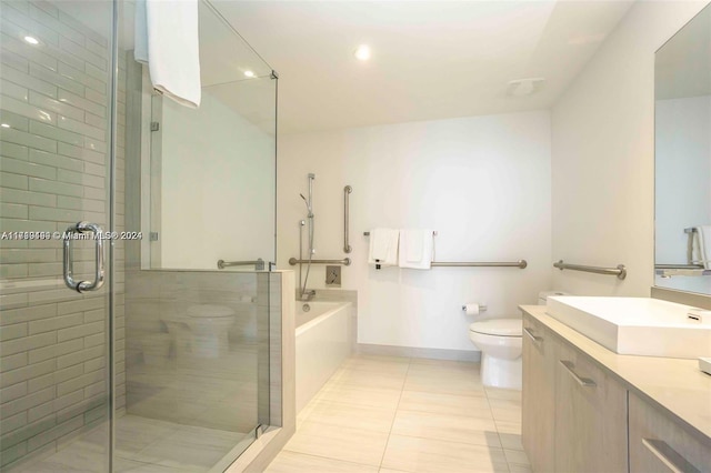 full bathroom featuring tile patterned flooring, vanity, separate shower and tub, and toilet