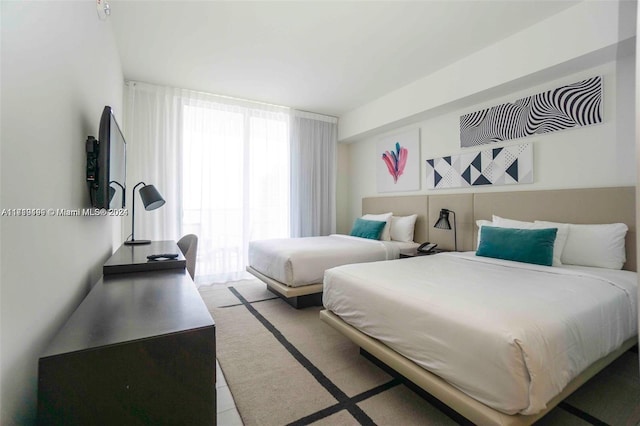 bedroom featuring light tile patterned floors