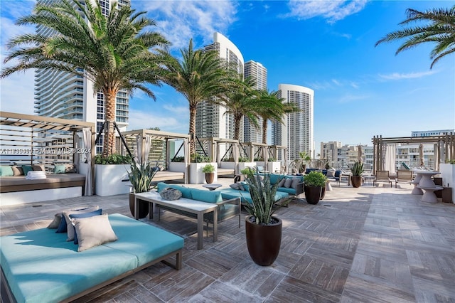 view of patio / terrace with outdoor lounge area and a pergola