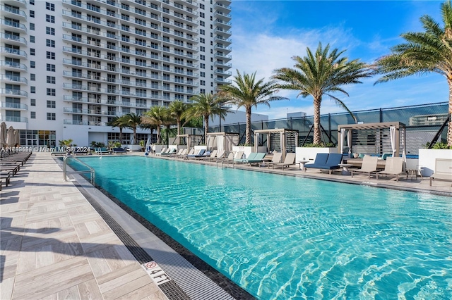 view of swimming pool featuring a patio area