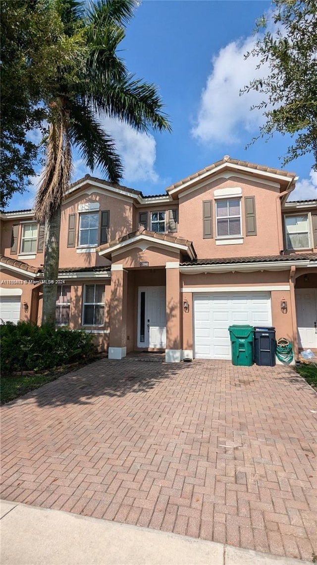 view of front of property with a garage