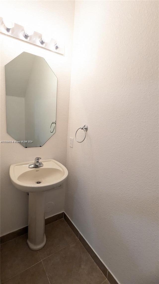 bathroom featuring tile patterned floors and sink