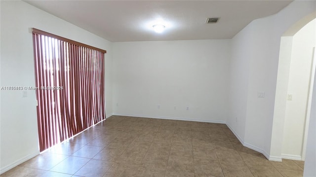 spare room with light tile patterned flooring