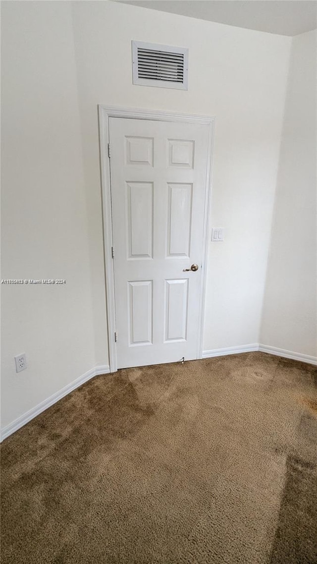 spare room featuring carpet flooring