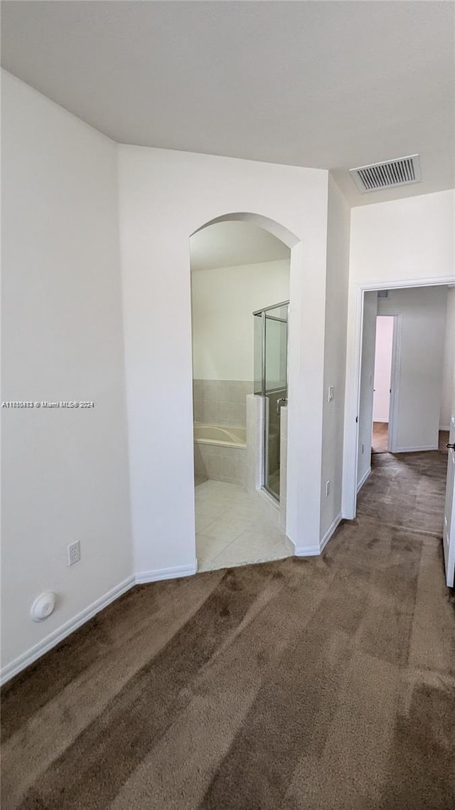 unfurnished room with carpet floors