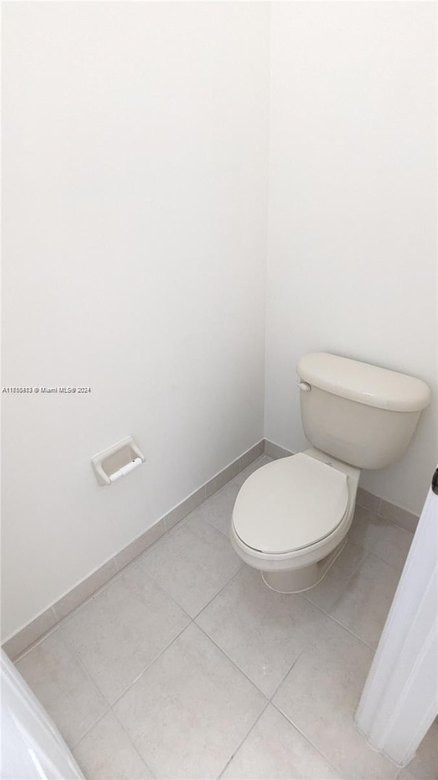 bathroom featuring tile patterned floors and toilet