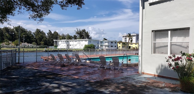 view of swimming pool with a patio