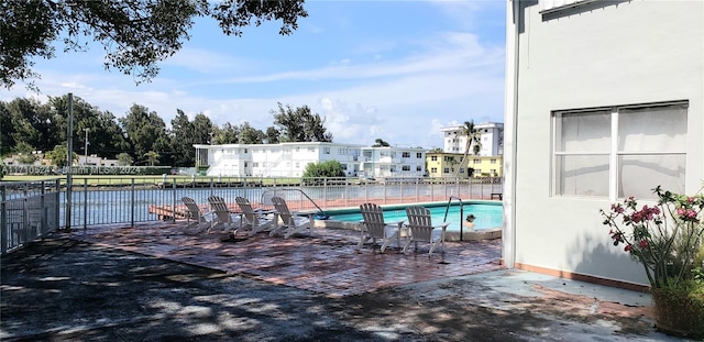 view of pool featuring a patio area