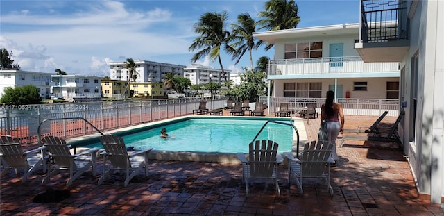 view of pool featuring a patio